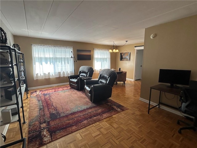 1326 6th Ave Unit 401, Beaver Falls, PA 15010 - living area featuring an office area, a chandelier, and baseboards