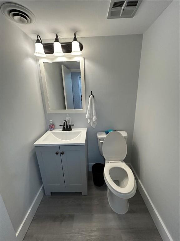 1326 6th Ave Unit 401, Beaver Falls, PA 15010 - half bath with baseboards, vanity, toilet, and wood finished floors