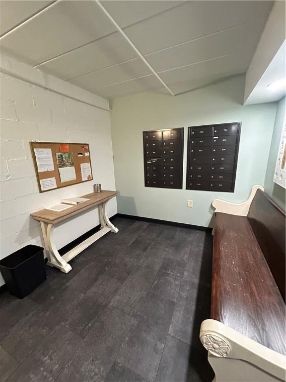 1326 6th Ave Unit 401, Beaver Falls, PA 15010 - interior space with mail area, dark wood-style flooring, and baseboards
