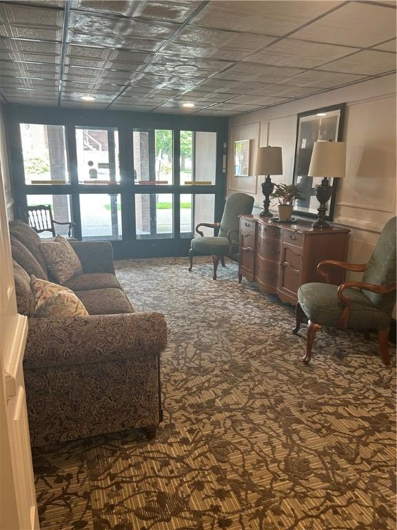 1326 6th Ave Unit 401, Beaver Falls, PA 15010 - living room featuring healthy amount of natural light and carpet floors