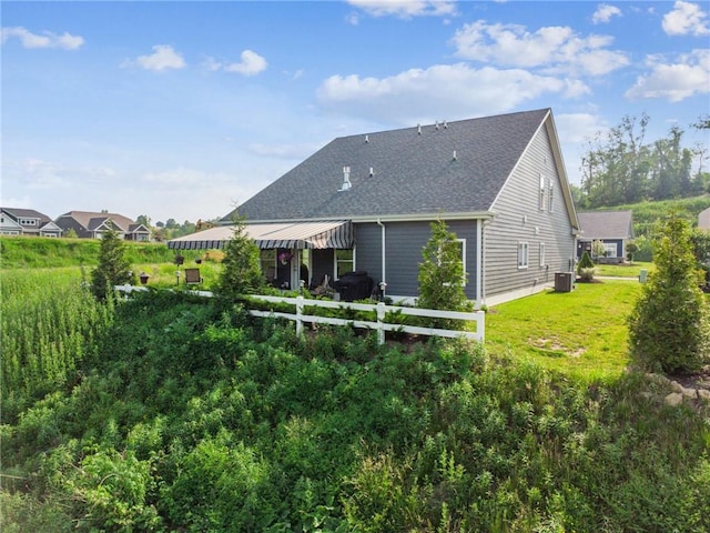137 Summer Ln, Mount Pleasant Twp Was, PA 15057 - back of house featuring roof with shingles, a yard, and cooling unit