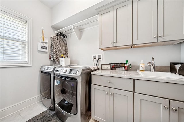 137 Summer Ln, Mount Pleasant Twp Was, PA 15057 - laundry area featuring separate washer and dryer, cabinet space, baseboards, and light tile patterned floors