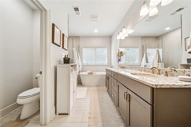 137 Summer Ln, Mount Pleasant Twp Was, PA 15057 - full bathroom featuring double vanity, toilet, a soaking tub, a tile shower, and tile patterned floors