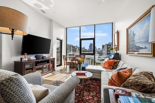 2554 Smallman St Unit 406, Downtown Pgh, PA 15222 - living area with wood finished floors and floor to ceiling windows