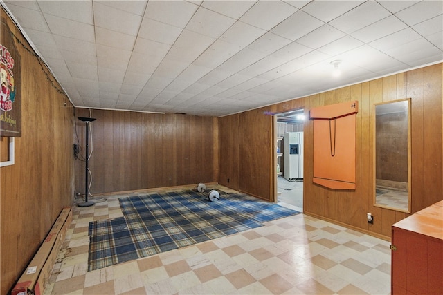131 Howley Ave, Chippewa Twp, PA 15010 - finished below grade area featuring light floors, wooden walls, and refrigerator with ice dispenser