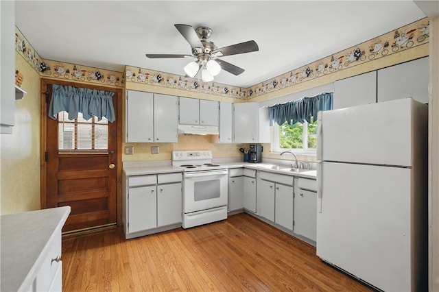 131 Howley Ave, Chippewa Twp, PA 15010 - kitchen with white appliances, a sink, under cabinet range hood, light countertops, and a ceiling fan