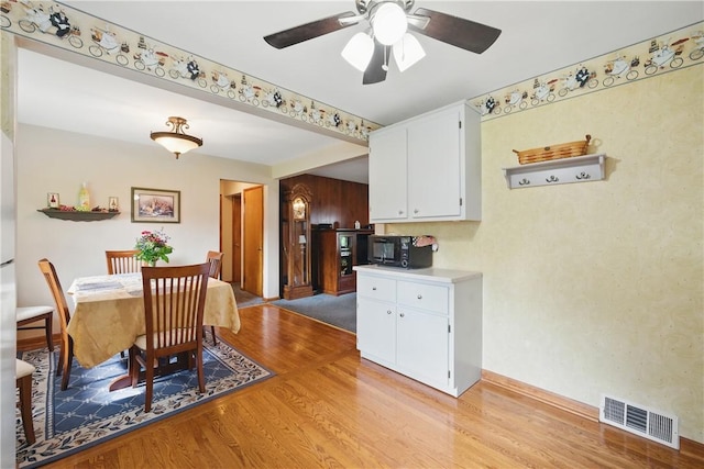 131 Howley Ave, Chippewa Twp, PA 15010 - dining area with light wood-style flooring, ceiling fan, and baseboards