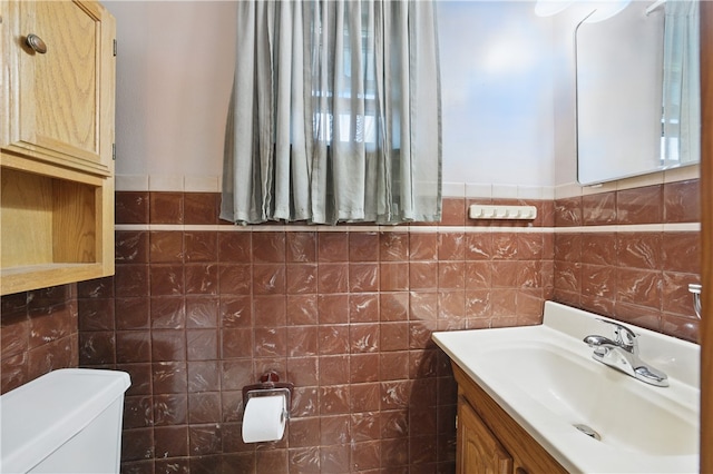 131 Howley Ave, Chippewa Twp, PA 15010 - half bath featuring toilet, tile walls, vanity, and a wainscoted wall