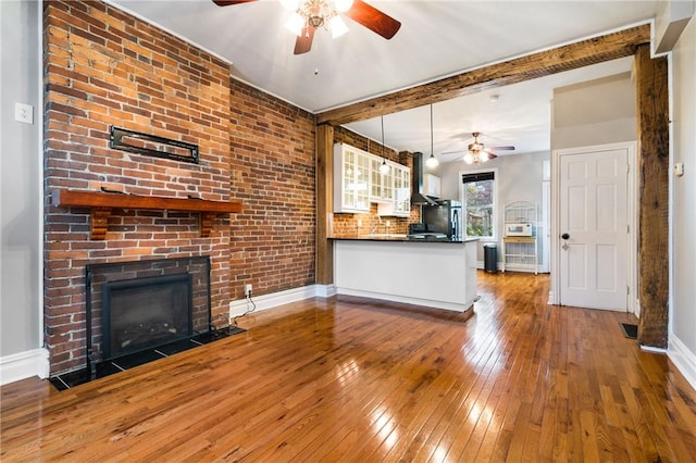 1812 Carey Way S, Side, PA 15203 - kitchen with a ceiling fan, wood-type flooring, dark countertops, a brick fireplace, and baseboards