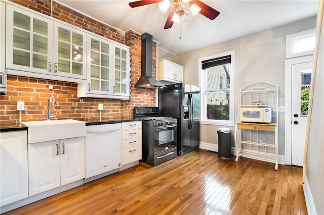 1812 Carey Way S, Side, PA 15203 - kitchen with black appliances, wall chimney range hood, a sink, baseboards, and a ceiling fan