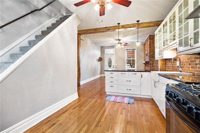 1812 Carey Way S, Side, PA 15203 - kitchen featuring ceiling fan, black gas range oven, a sink, light wood finished floors, and beamed ceiling