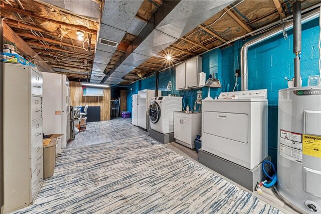 922 Old Ridge Rd, Cross Creek Twp, PA 15340 - unfinished basement featuring washing machine and dryer, water heater, and freestanding refrigerator
