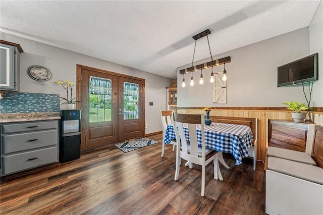 922 Old Ridge Rd, Cross Creek Twp, PA 15340 - dining area featuring dark wood finished floors, a textured ceiling, and wood walls