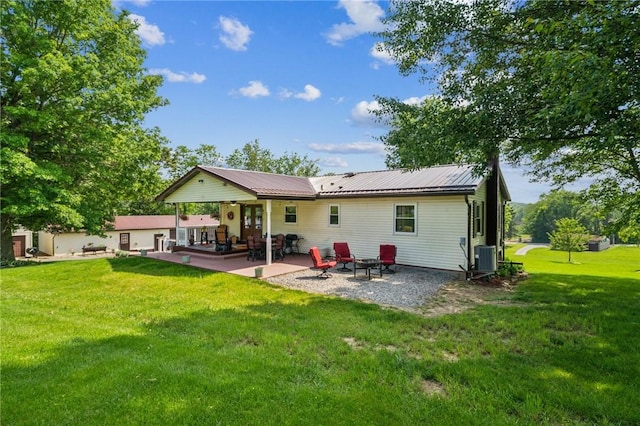 922 Old Ridge Rd, Cross Creek Twp, PA 15340 - rear view of property featuring a patio area, a lawn, and a metal roof