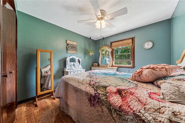 922 Old Ridge Rd, Cross Creek Twp, PA 15340 - bedroom featuring wood finished floors, a textured ceiling, and ceiling fan