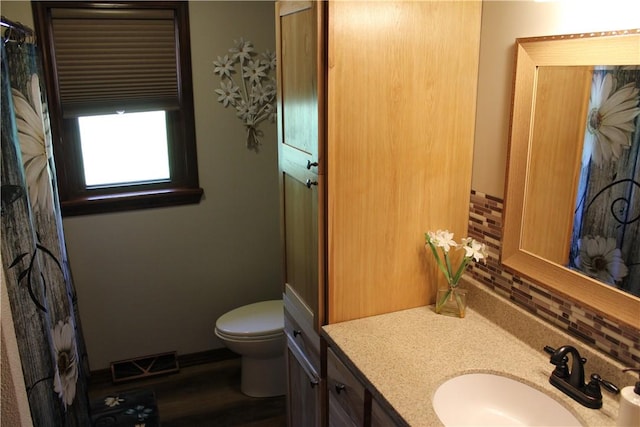 922 Old Ridge Rd, Cross Creek Twp, PA 15340 - bathroom with vanity, decorative backsplash, and wood finished floors