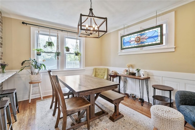 1403 Creedmoor Ave, Brookline, PA 15226 - dining area with ornamental molding, a chandelier, wood finished floors, and a wainscoted wall
