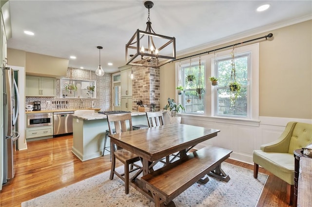 1403 Creedmoor Ave, Brookline, PA 15226 - dining room featuring a chandelier, light wood-style flooring, wainscoting, crown molding, and recessed lighting