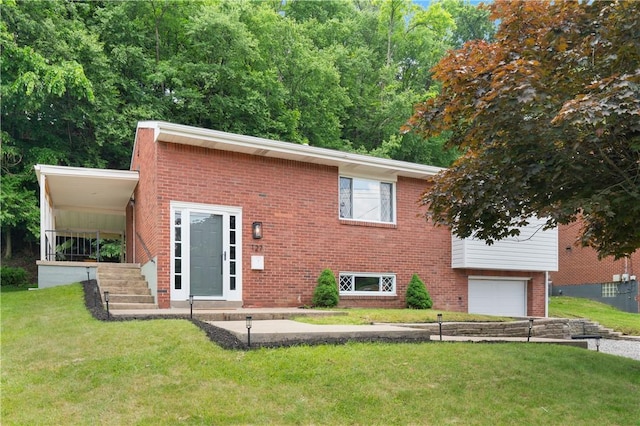 127 Greenview Dr, Penn Hills, PA 15147 - view of front of home with brick siding, a garage, and a front yard