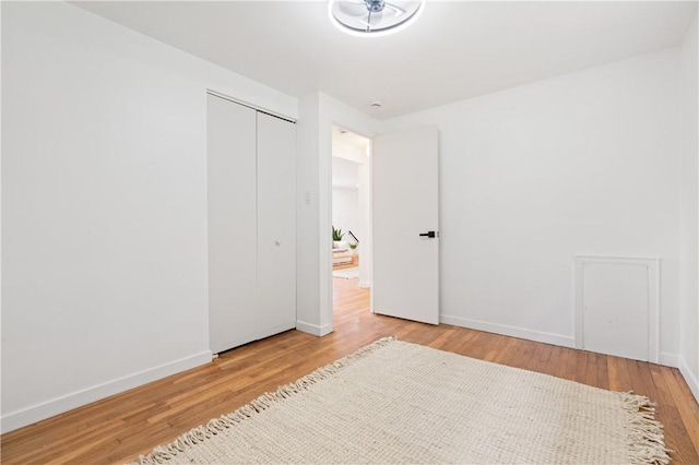 127 Greenview Dr, Penn Hills, PA 15147 - unfurnished bedroom with wood finished floors, a closet, and baseboards