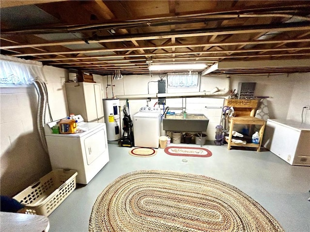 206 Richards Dr, Derry Twp, PA 15650 - below grade area with electric water heater, separate washer and dryer, and a sink