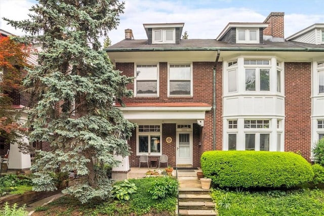 5304 Saint James Ter, Shadyside, PA 15232 - view of front of property featuring brick siding, a porch, and a chimney