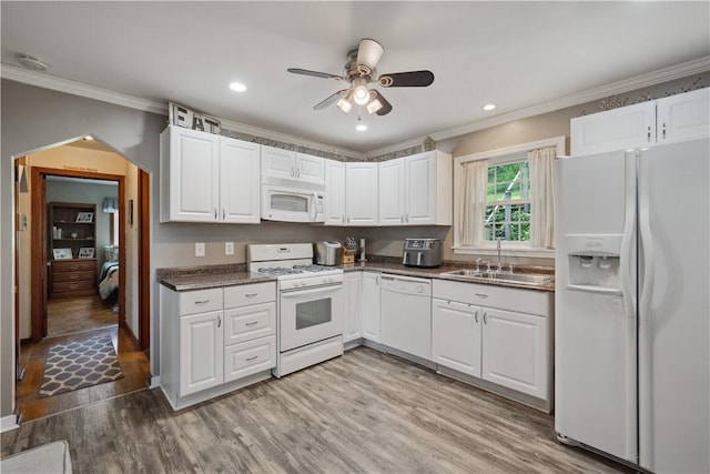 801 4th St N, Versailles, PA 15137 - kitchen featuring white appliances, a sink, crown molding, dark countertops, and white cabinetry