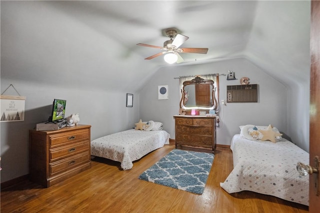801 4th St N, Versailles, PA 15137 - bedroom featuring wood finished floors, vaulted ceiling, and a ceiling fan