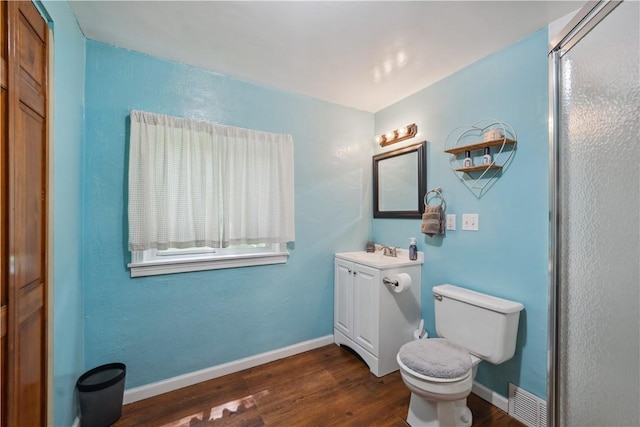 801 4th St N, Versailles, PA 15137 - bathroom with vanity, toilet, wood finished floors, and baseboards