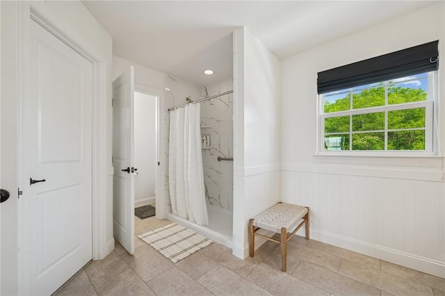 108 Berkshire Ct, Ohio Twp, PA 15237 - full bathroom featuring a marble finish shower, wainscoting, and tile patterned floors