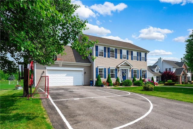 565 Tara Ct, Saxonburg Boro, PA 16056 - colonial-style house featuring a garage, asphalt driveway, and a front yard