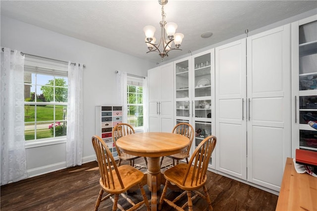 565 Tara Ct, Saxonburg Boro, PA 16056 - dining space with dark wood-style flooring, a chandelier, baseboards, and a textured ceiling
