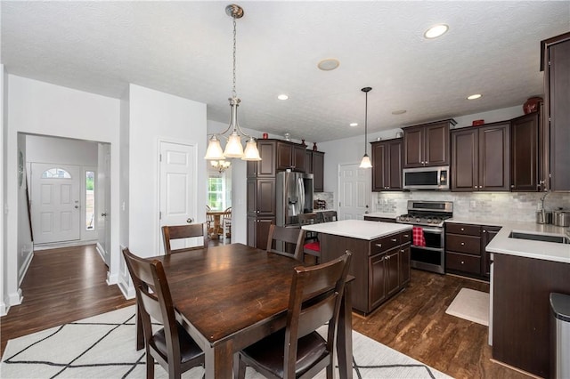 565 Tara Ct, Saxonburg Boro, PA 16056 - dining space featuring dark wood-type flooring, a chandelier, recessed lighting, and baseboards
