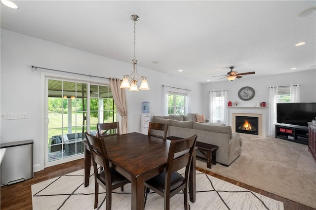 565 Tara Ct, Saxonburg Boro, PA 16056 - dining area featuring plenty of natural light, a ceiling fan, recessed lighting, and a warm lit fireplace