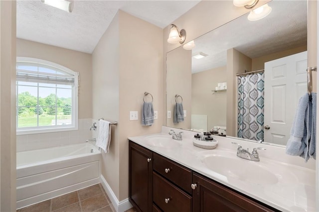 565 Tara Ct, Saxonburg Boro, PA 16056 - full bath with tile patterned floors, double vanity, baseboards, a bath, and a textured ceiling