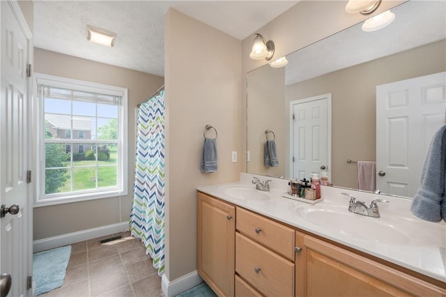 565 Tara Ct, Saxonburg Boro, PA 16056 - full bath featuring baseboards, double vanity, tile patterned floors, and a shower with curtain