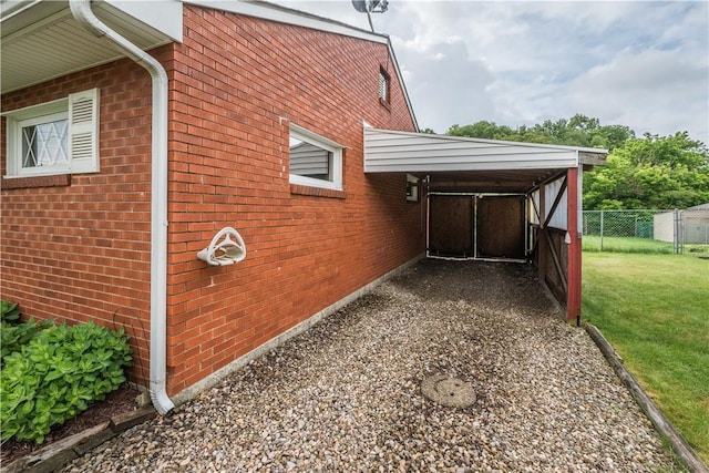 102 Jordan St, Bethel Park, PA 15102 - view of home's exterior with brick siding and a carport