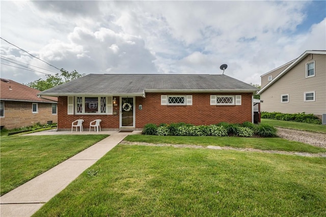 102 Jordan St, Bethel Park, PA 15102 - view of front of house with brick siding, a front lawn, and covered porch