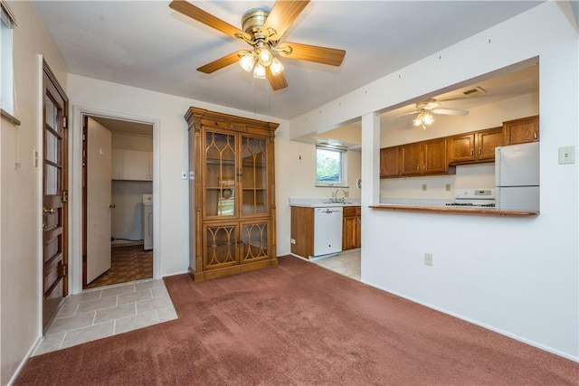 102 Jordan St, Bethel Park, PA 15102 - kitchen with white appliances, a ceiling fan, brown cabinets, light colored carpet, and a sink