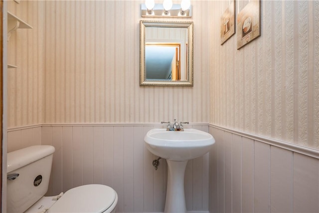 102 Jordan St, Bethel Park, PA 15102 - half bathroom featuring wallpapered walls, a wainscoted wall, and toilet