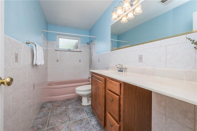 102 Jordan St, Bethel Park, PA 15102 - full bath with tile walls,  shower combination, toilet, vanity, and a chandelier