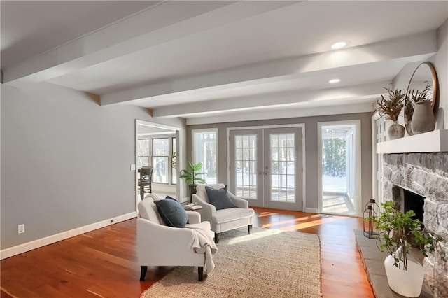 9 Victoria Dr, Neshannock Twp, PA 16105 - living area with french doors, healthy amount of natural light, beamed ceiling, wood finished floors, and baseboards