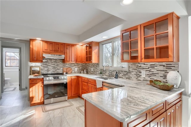 9 Victoria Dr, Neshannock Twp, PA 16105 - kitchen with stainless steel range oven, under cabinet range hood, light stone countertops, plenty of natural light, and recessed lighting