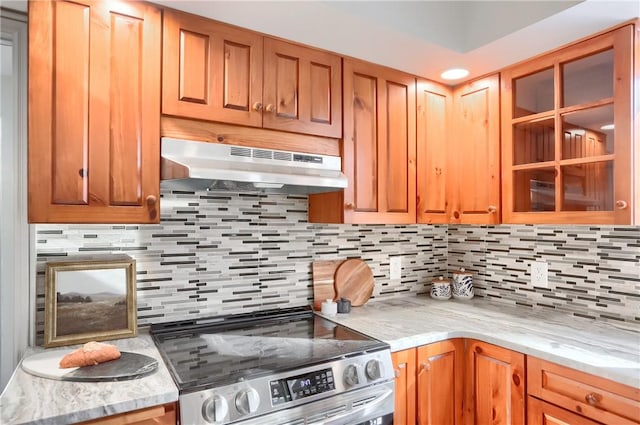 9 Victoria Dr, Neshannock Twp, PA 16105 - kitchen with under cabinet range hood, stainless steel electric range oven, tasteful backsplash, and light stone counters