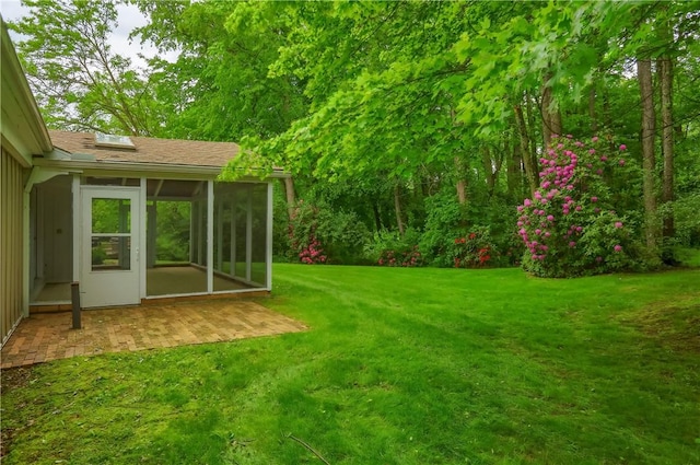 9 Victoria Dr, Neshannock Twp, PA 16105 - view of green lawn with a sunroom and a patio area