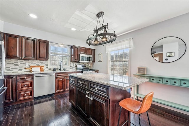 536 Cherryhill Dr, Cecil, PA 15017 - kitchen with appliances with stainless steel finishes, a breakfast bar, dark wood-type flooring, recessed lighting, and a sink