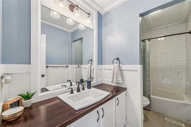536 Cherryhill Dr, Cecil, PA 15017 - bathroom featuring vanity, toilet, shower / bathtub combination with curtain, wainscoting, and crown molding