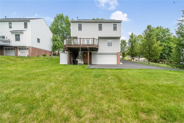 536 Cherryhill Dr, Cecil, PA 15017 - back of property featuring a garage, a deck, a lawn, and driveway