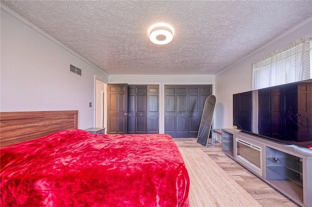 4822 W State St, Mahoning Twp Law, PA 16116 - bedroom featuring wood finished floors, multiple closets, a textured ceiling, and crown molding