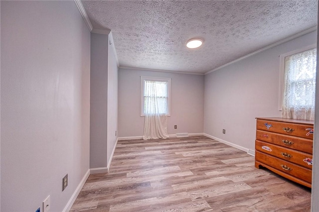 4822 W State St, Mahoning Twp Law, PA 16116 - spare room with crown molding, light wood-style flooring, baseboards, and a textured ceiling